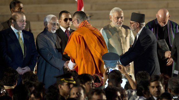 Newly sworn-in Indian Prime Minister Narendra Modi (3rd R) shakes hands Nepalese Prime Minister Sushil Koirala (2nd R)
