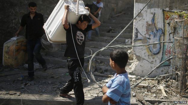 People recover belongings from damaged houses in Gaza - 1 August
