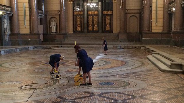 Cleaners washing the Minton tiles