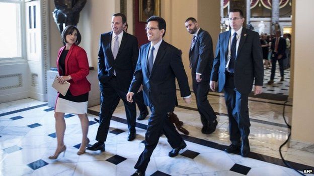 House Majority Leader Representative Eric Cantor (C) (R-VA) walks to a vote during his last day as Majority Leader on Capitol Hill 31 July 2014