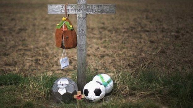 A wooden memorial cross marks the field in Flanders, where British and German soldiers played football during the World War One Christmas Day truce