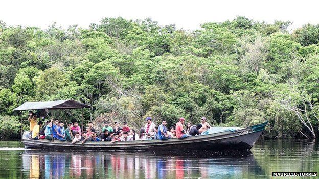 Munduruku travel on a boat in April 2014