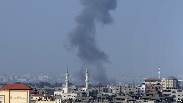 Smoke rises over Gaza City after an Israeli strike minutes before the time agreed for a preliminary 72-hour ceasefire, on Tuesday Aug, 5, 2014