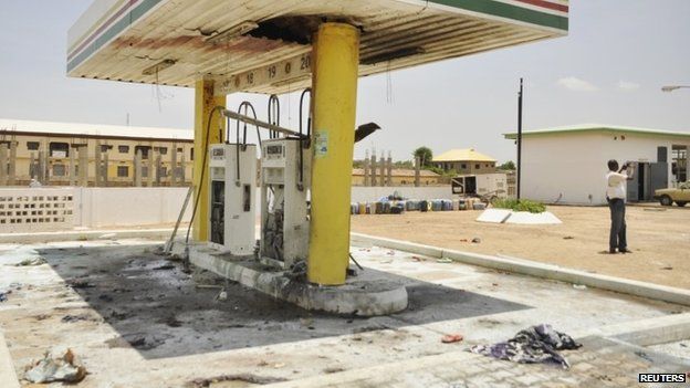 A petrol station is seen after a female suicide bomber blew herself in the city of Kano - 28 July 2014