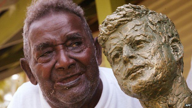 Biuku Gasa in 2003 with the bust of John F. Kennedy presented to him by the Kennedy family
