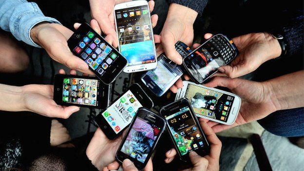 People showing their different smartphones