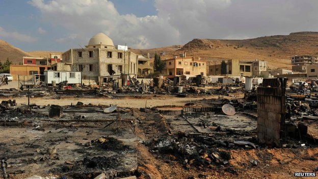 A general view shows damage and burnt tents for Syrian refugees from the fighting between Lebanese army soldiers and Islamist militants in the Sunni Muslim border town of Arsal, in eastern Bekaa Valley