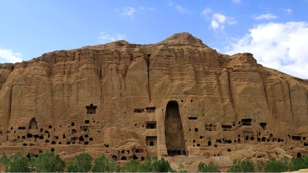 The niche once occupied by the 38 and 55 metre high buddha statues dominates the Bamiyan cliffs
