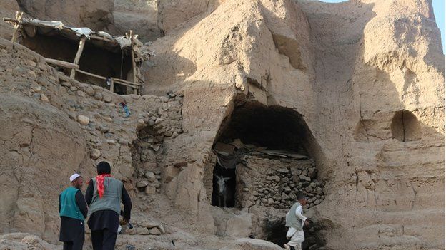 Many of the ancient caves have been modified with wood and mud brick constructions