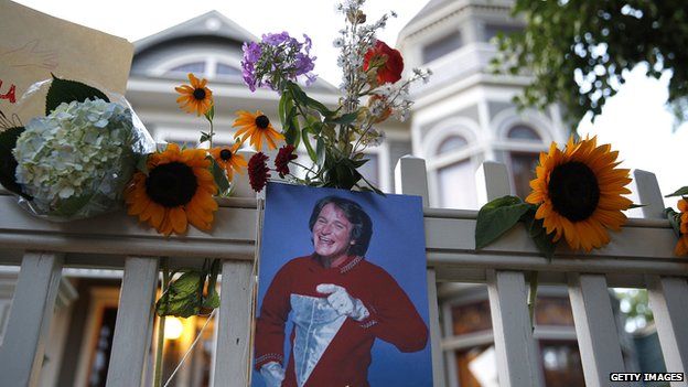 Floral tributes outside the 'Mork and Mindy house' in Boulder, Colorado