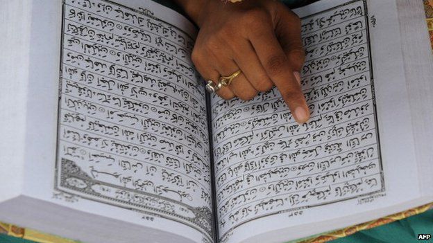 Indian Muslim reading from the holy book