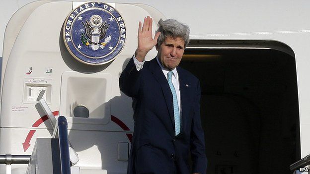 US Secretary of State John Kerry waves to officials and guests before departing from Sydney, Australia, on 13 August 2014