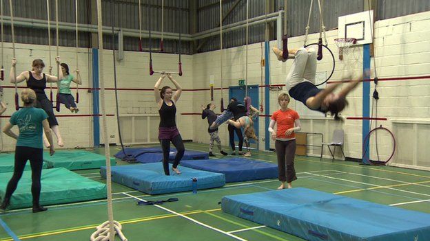 trapeze class with several women training