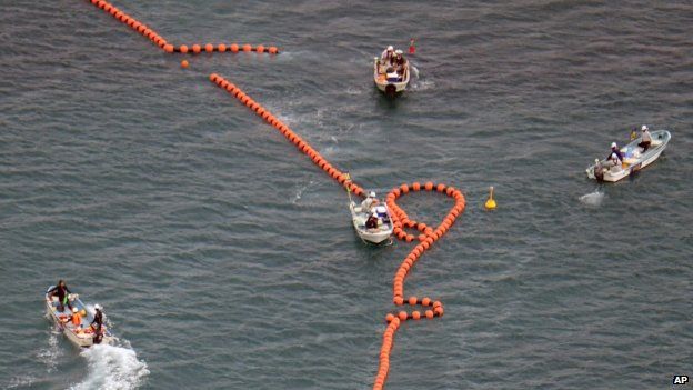 In this aerial photo, workers in boats set up no-go zone in the sea off Nago, Okinawa, southern Japan, Thursday, on 14 Aug 2014