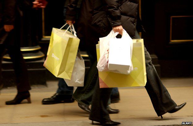 People carrying shopping bags in Oxford Street