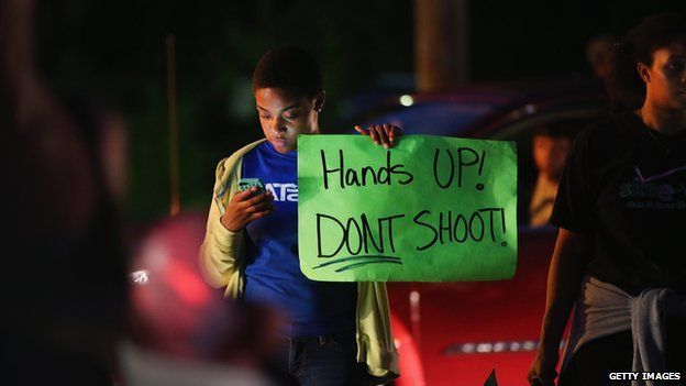 Demonstrators gather along West Florissant Avenue to protest the shooting and death of Michael Brown on August 15, 2014 in Ferguson, Missouri