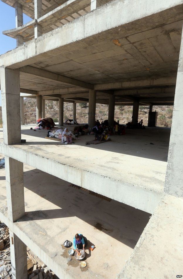 Yazidi refugees shelter in an unfinished building in Dohuk, northern Iraq, 16 August