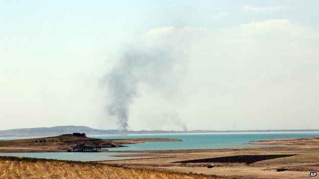 Smoke rises during air strikes on the dam - 18 August
