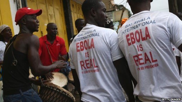 Ebola awareness campaigners stage a street performances at an event in Monrovia, Liberia - 18 August 2014