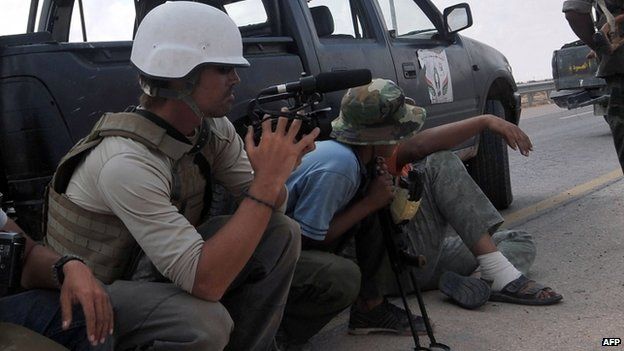 James Foley (left) film near the Libyan town of Sirte. Photo: 2011