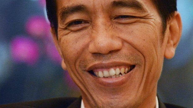 This picture taken on 30 July, 2013, Jakarta governor Joko Widodo, smiles during an interview in his office in Jakarta's city hall