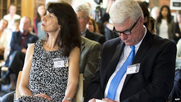 Diane and John Foley listening to a talk about their son in 2013