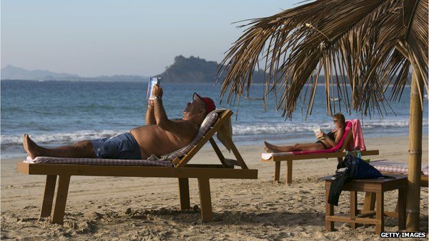 Tourists relaxing on a Burmese beach