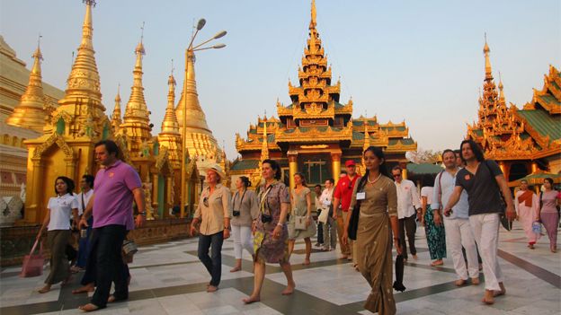 Tourists at walking around the Shwedagon pagoda in Yangon