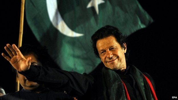 Imran Khan waves to supporters at a mass anti-government protest in Islamabad - 20 August 2014