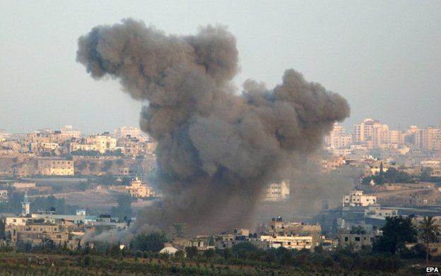 Smoke rises after an Israeli air strike on the northern Gaza Strip, 21 August