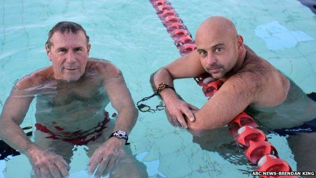 Cyril Baldock and his coach in the swimming pool