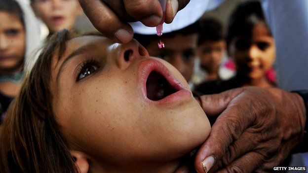 Girl getting polio vaccine