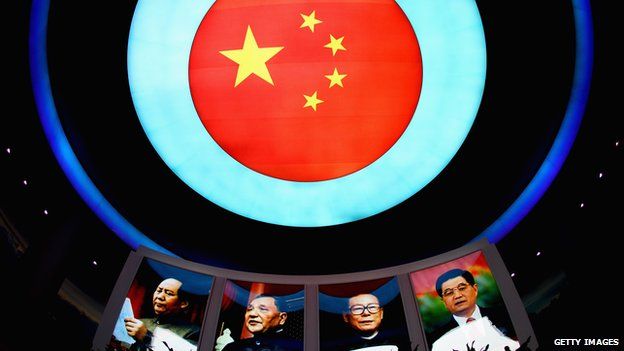 This file photo taken on 28 September, 2013 shows portraits of Chinese President Xi Jinping along with his predecessors Hu Jintao, Jiang Zemin and Deng Xiaoping on display at a museum in Tianjin