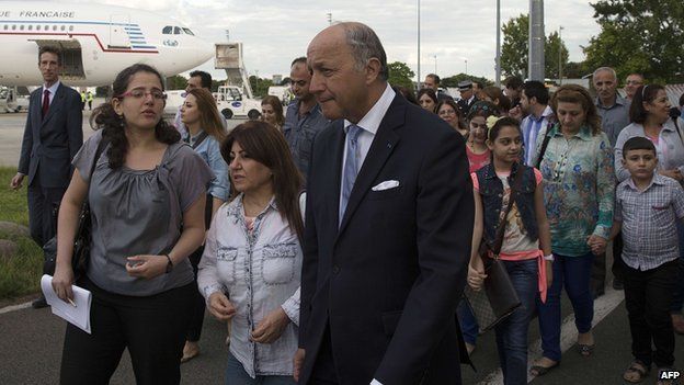 Newly arrived Iraqi Christians with French Foreign Minister Laurent Fabius