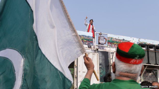 Imran Khan making a speech on top of his shipping container