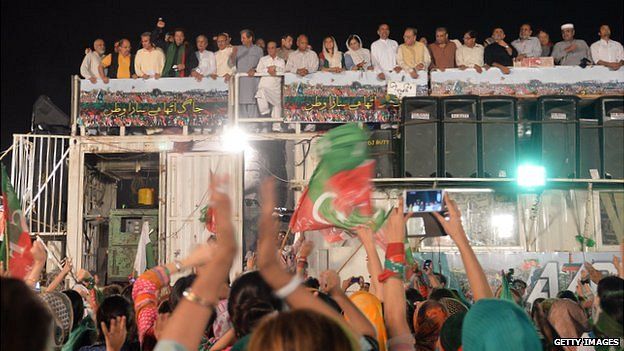 Imran Khan on top of a shipping container