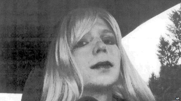 In this undated file photo provided by the US Army, Pte Chelsea Manning poses for a photo wearing a wig and lipstick