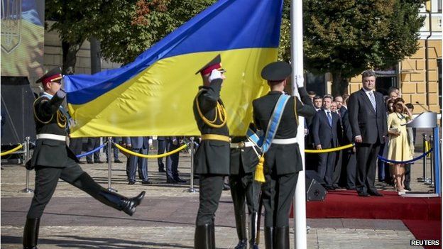 Ukraine' President Petro Poroshenko (R, on a platform) attends a ceremony for National Day in Kiev, 23 August 2014