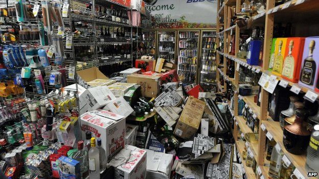 Bottles of liquor are strewn about inside Val's Liquor in downtown Napa (24 August 2014)