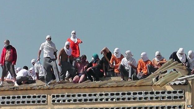 Rioters on roof of prison with hostages - 24 August