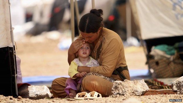 A Yazidi Iraqi woman and her child at at the Nowruz refugee camp in Qamishli, Syria (17 August 2014)