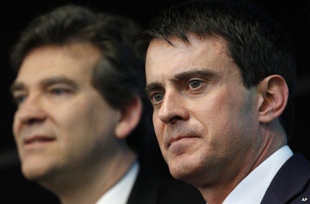 Manuel Valls (R) with Arnaud Montebourg on a visit to defence and electronic company Thales in Gennevilliers, outside Paris, 10 April 2014