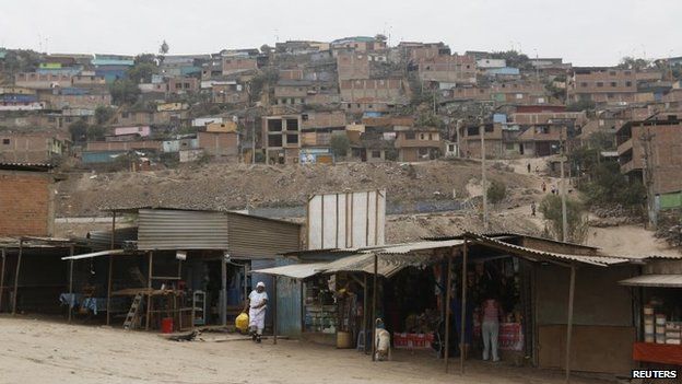 A view of the marketplace and homes of Gosen City, a slum in the Villa Maria del Triunfo municipality on the outskirts of Lima, March 17, 2014.