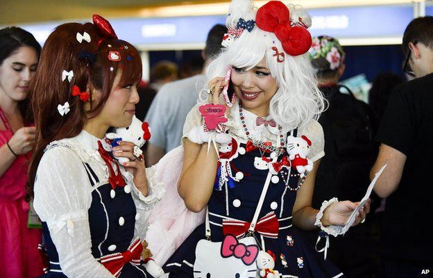 People wearing Hello Kitty accessories