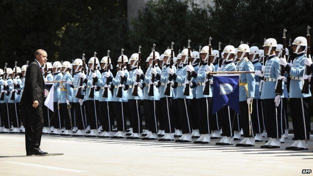 Turkey's new President Tayyip Erdogan (front) attends a swearing in ceremony in front of the parliament building (28 August 2014)