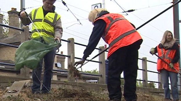 Clear-up work at Shepreth Station where poppies were planted