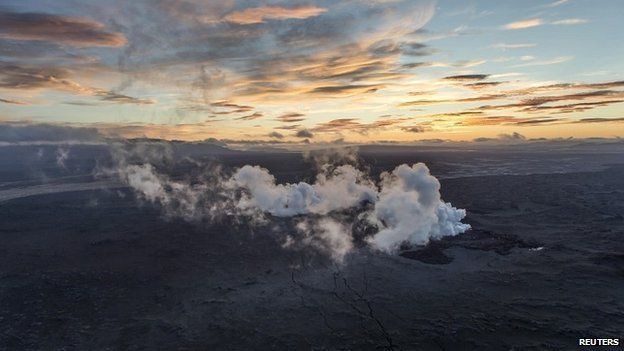Steam rises over a 1-km-long fissure in a lava field north of the Vatnajokull glacier, which covers part of Bardarbunga volcano system - 29 August 2014
