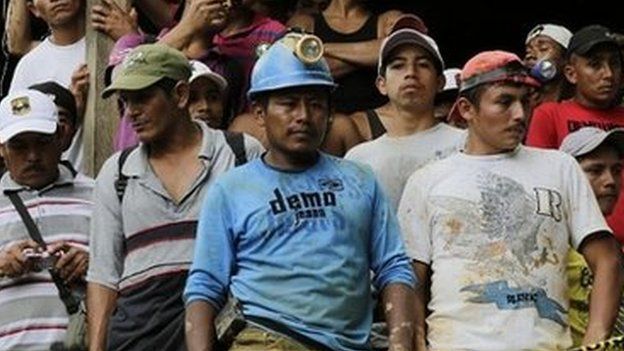 Relatives, friends and fellow miners wait as rescuers try to reach a group of miners trapped in a gold mine in Nicaragua - 29 August 2014