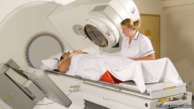 Radiotherapist watching a patient