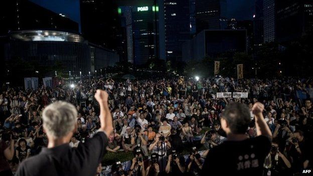 Benny Tai (R) rallies the democracy supporters, 31 Aug